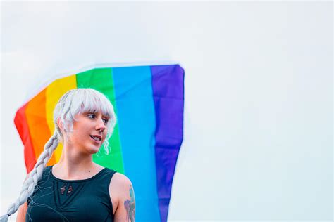 Lesbian Girl Holding Lgbt Flag At Gay Parade Photograph By Cavan Images