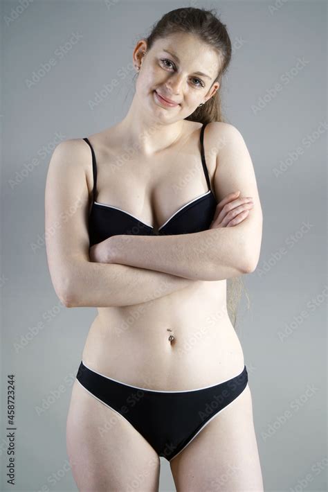 Beautifuly Cute Teenage Girl Posing In Black Bikini In Studio Stock Photo Adobe Stock