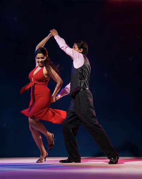 Young Couple Swing Dancing Indoors Photograph By Pm Images Pixels