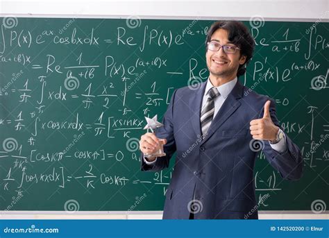 The Young Male Math Teacher In Classroom Stock Photo Image Of