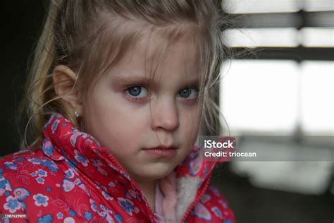 Portrait Of Little Sad Girl In Ruined Building Refugees War Crisis