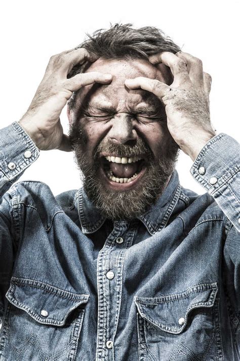 Portrait Of Screaming Man With Dirty Face Stock Photo