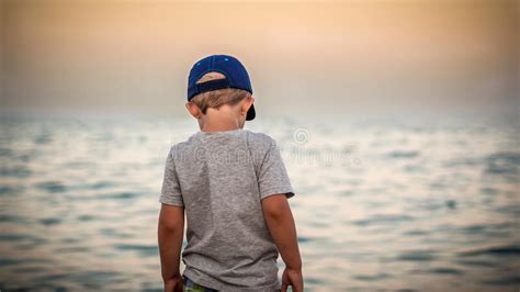 Boy Is Watching Evening Sea Stock Image Image Of Outdoor Hope 58082709