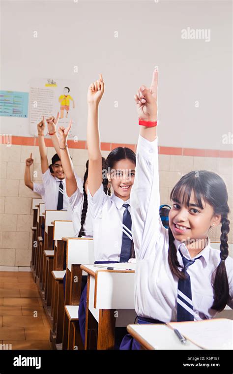 Indian Group School Kids Students Studying Hand Raised In Class