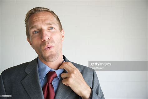 Relieved Businessman Getting Hot Under The Collar High Res Stock Photo