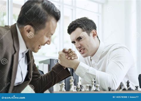 Serious Businessman Playing Board Chess Game Together Competition And