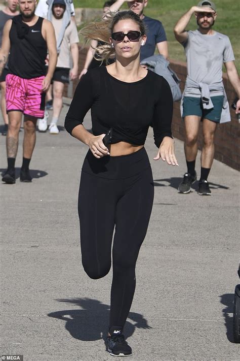 Natasha Oakley Flashes Her Washboard Abs In A Crop Top As She Goes For A Jog In Sydneys Bondi
