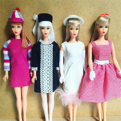 Three Barbie Dolls Are Standing Next To Each Other In Dresses And Hats