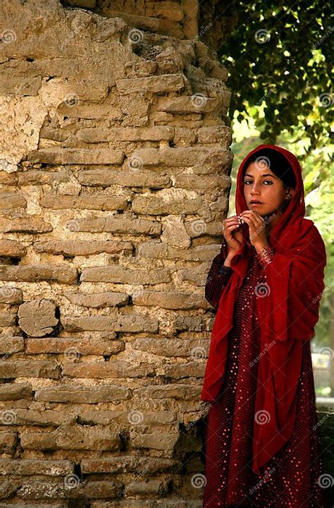 A Traditional Afghan Girl In A Red Dress In Balkh Afghanistan