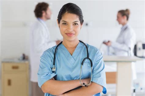 Confident Nurse Smiling At The Camera Stock Photo Image Of Hand
