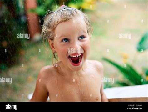 Close Up Portrait Of Happy Cute Little Girl Enjoy Summer Rain Drops