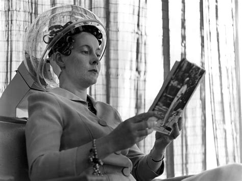 woman female under hairdryer in beauty salon photograph by mark goebel fine art america