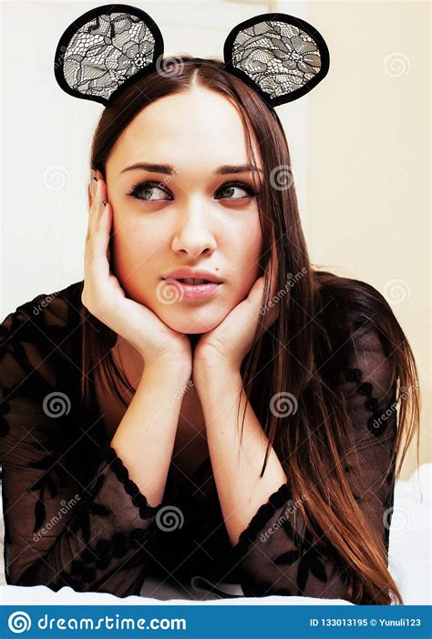 Young Pretty Brunette Woman Wearing Lace Mouse Ears Laying Stock Image