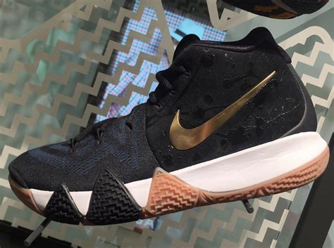 Dressed in an elegant white, black, and metallic gold color scheme. The Nike Kyrie 4 Pops Up In Black And Gold • KicksOnFire.com