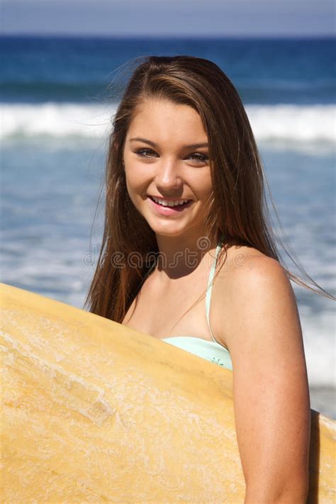 Beautiful Teenage Girl Sitting On A Surfboard Stock Image Image Of