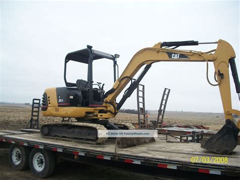 The 303.5e cr features the following: Cat 303. 5 Mini Excavator 2001 2300hrs