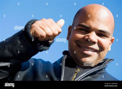 Portrait Of A Mid Adult Man Showing Thumbs Up Sign Stock Photo Alamy