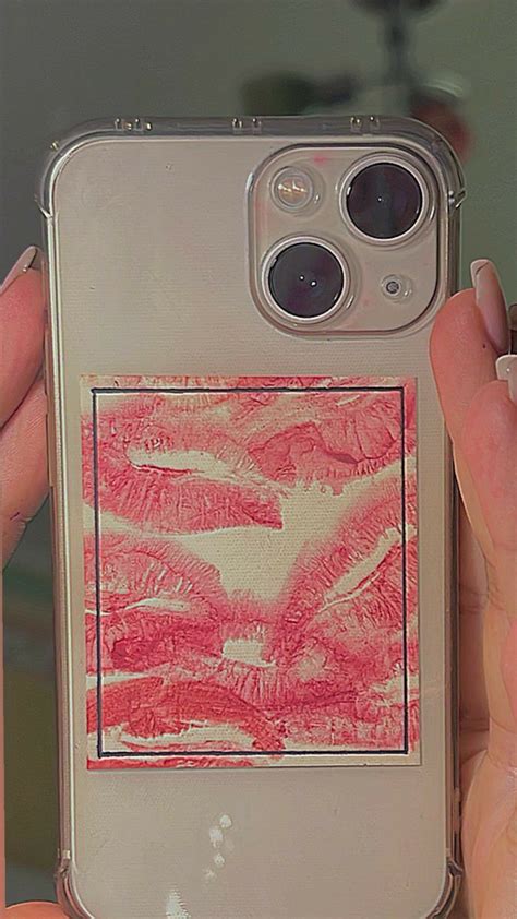 A Person Holding Up An Iphone Case With A Drawing On The Back And