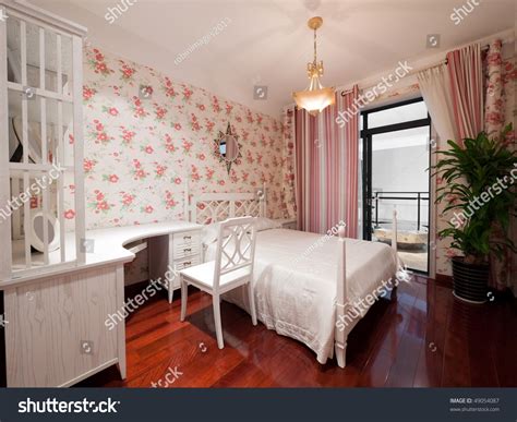 Bedroom Interior With Beautiful Wallpaper Stock Photo