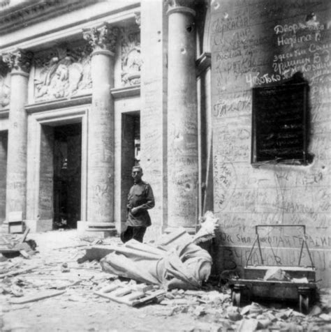 A Soviet Soldier Stands In Front Of A Ruin In Berlin Possibly The