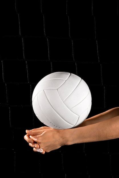 Premium Photo Hand Holding Volley Ball