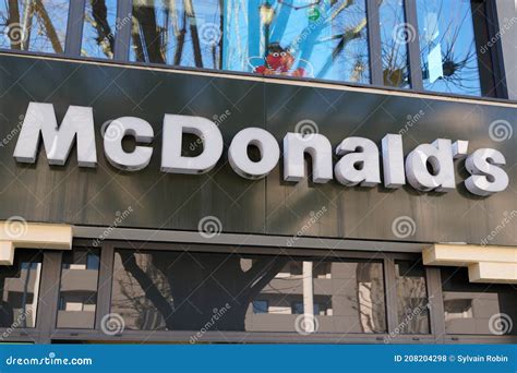 Mcdonald`s Sign Text And Brand Logo On Restaurant Exterior Of Mcdonalds