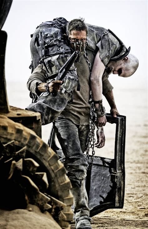 Hardy Carries Hoult Who Plays Nux Mad Max Fury Road Pictures Popsugar Entertainment Photo