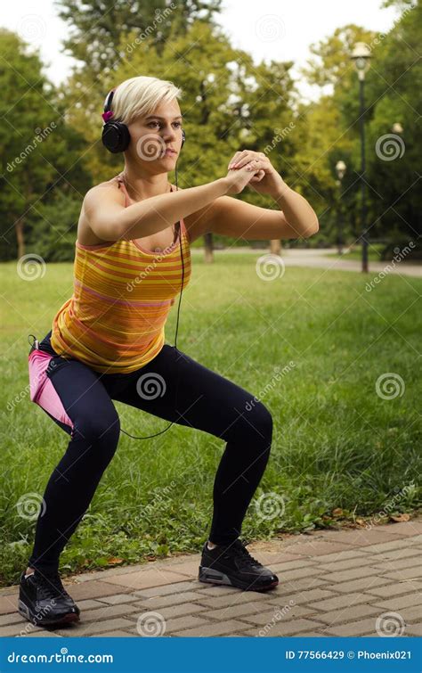 Fit Pretty Young Woman Doing Squats In Park Stock Image Image Of