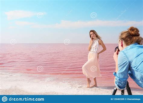Female Photographer Taking Pictures Of Model Near Lake Stock Image Image Of Port Holiday