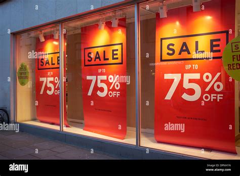 Sale Up To 75 Off Banners In A Shop Window Stock Photo Alamy