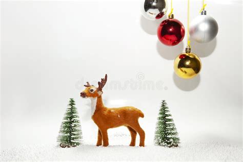 Christmas Holiday Theme With Reindeer And Christmas Trees Stock Image