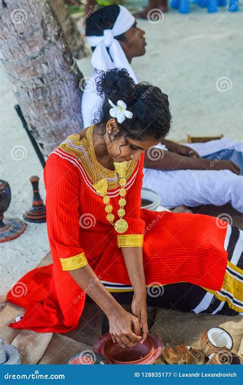 Beautiful Maldivian Woman In National Dress Cooking Coconut Editorial