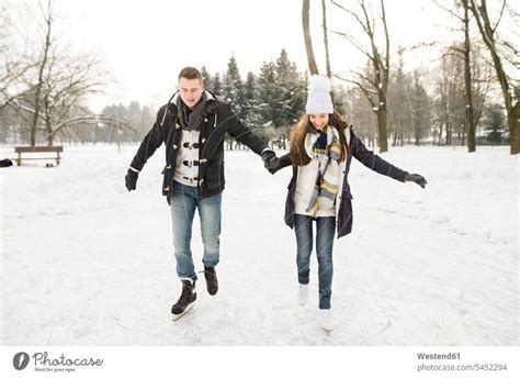 Couple Ice Skating On A Frozen Lake A Royalty Free Stock Photo From