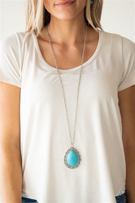 A Refreshing Turquoise Stone Teardrop Is Pressed Into The Center Of An