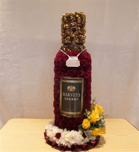 Funeral posies and funeral baskets expertly prepared, using the freshest flowers. Bottle of Sherry. Made by The Flower Lodge - London ...