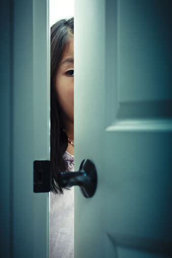 Peeking Behind A Door Stock Photo - Download Image Now - iStock