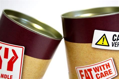 Two Cans With Signages · Free Stock Photo