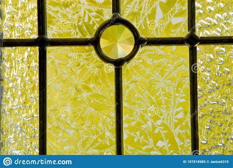 Etched Glass Window Backlit With Bright Yellow Autumn Color Shinning