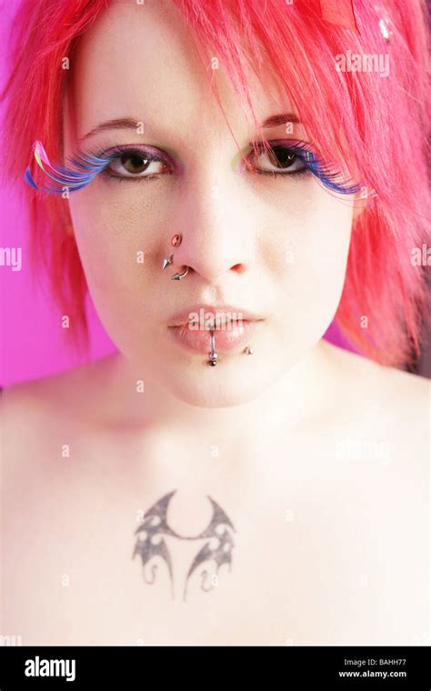 Head Shot Of A Pretty Cyber Punk Girl With Pink Hair And Large Fake