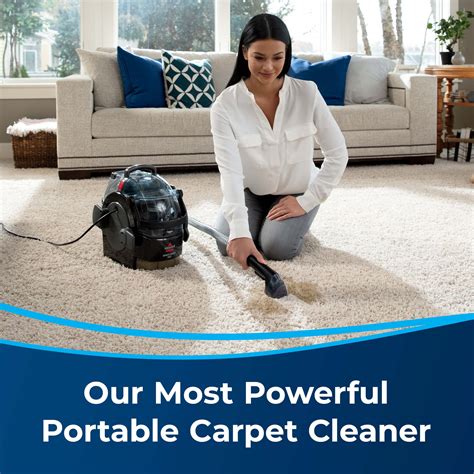 A Woman Kneeling Down On The Floor With Her Vacuum In Front Of Her