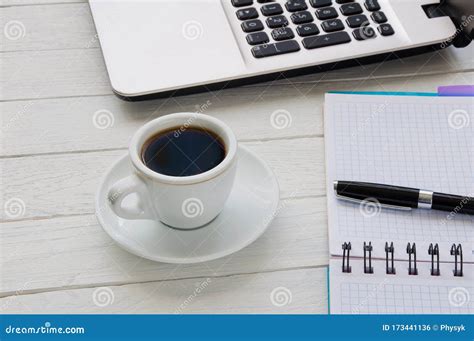 Cup Of Coffee Notebook With Pen And Laptop On White Desktop Stock