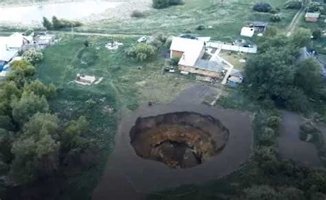 Watch Giant Sinkhole Deep As Multi Storey Building Opens Up In Russia
