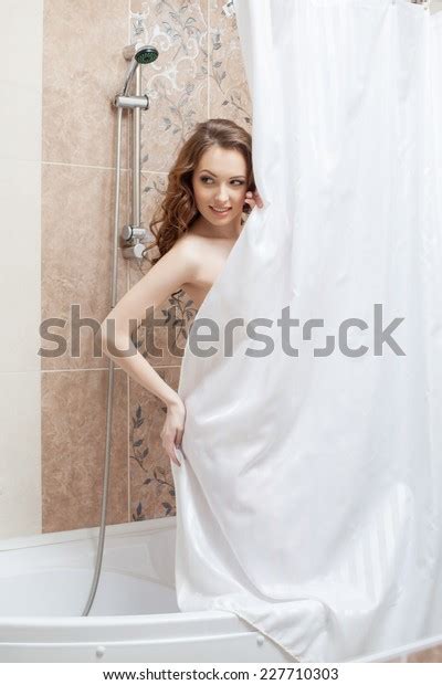 Pretty Naked Woman Hiding Behind Shower Stock Photo