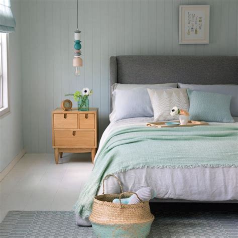 Mint Bedroom With Upholstered Grey Bed And White Wood Flooring Ideal