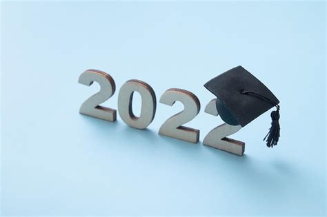 Premium Photo Graduation 2022 Wearing Graduate Hat On Wooden Number
