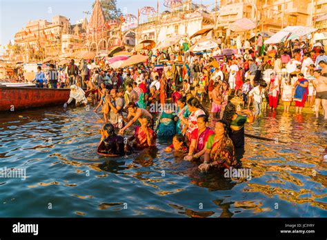 Pilgrims Are Taking Bath In The Holy River Ganges At Dashashwamedh Ghat Main Ghat In The