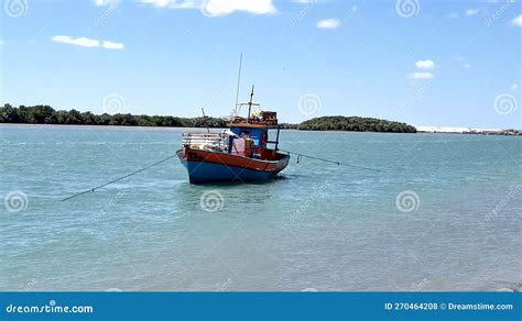 Lonely Fishing Boats Anchored On The Beach Sea Fishing Stock Photo