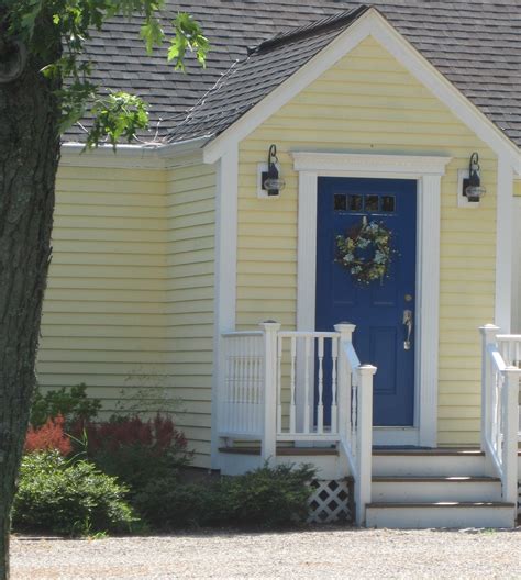 Simply beautiful, we love the color and would love to know exactly what color the yellow is???n the name specifically, thank you so much!!! Yellow house, blue door | House paint exterior, Yellow ...
