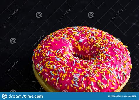 Pink Glazed Donut With Sprinkles Isolated Close Up Of Colorful Donut