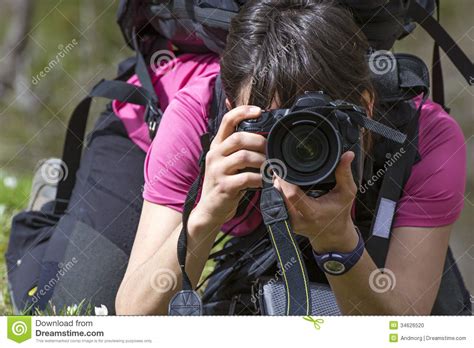 Young Woman Photographer In Action Stock Photo Image
